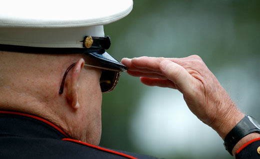 Elderly man doing hand salute